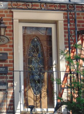 A door with a stained glass window on it.